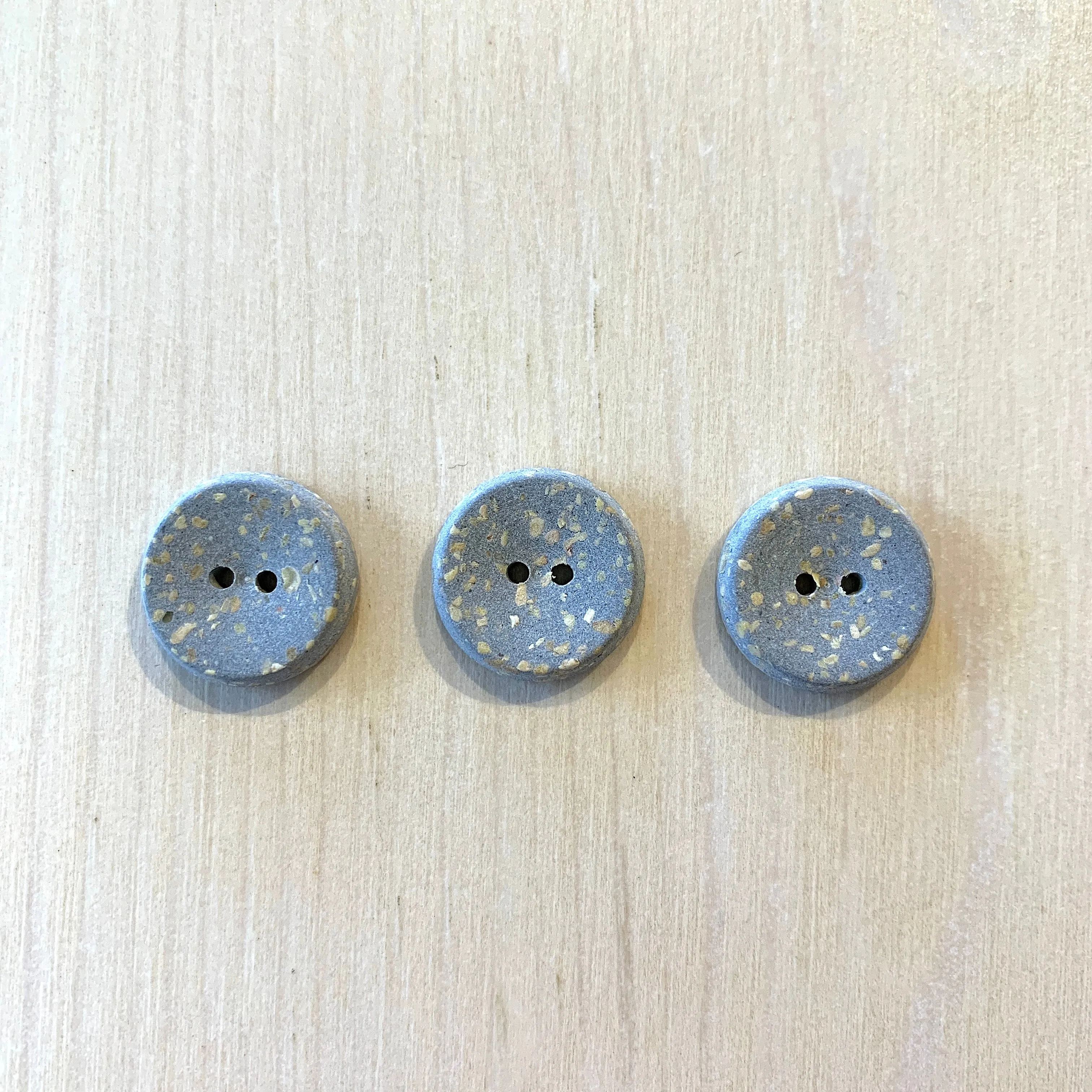 Recycled polyester buttons
