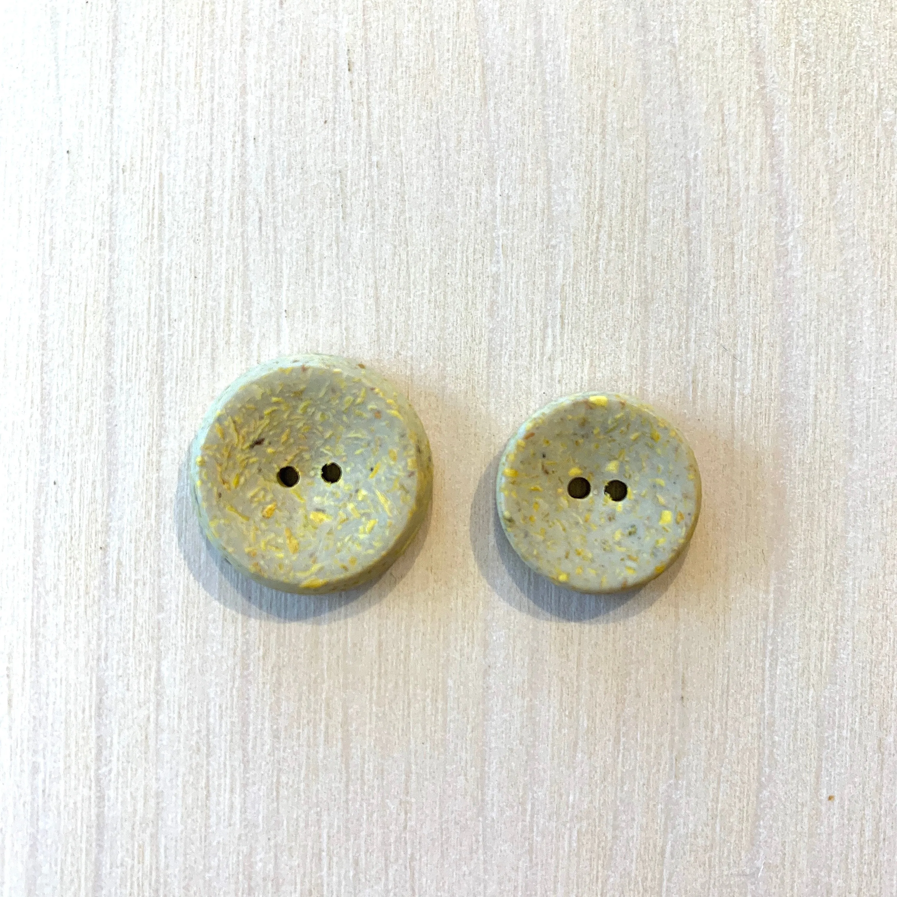 Recycled polyester buttons