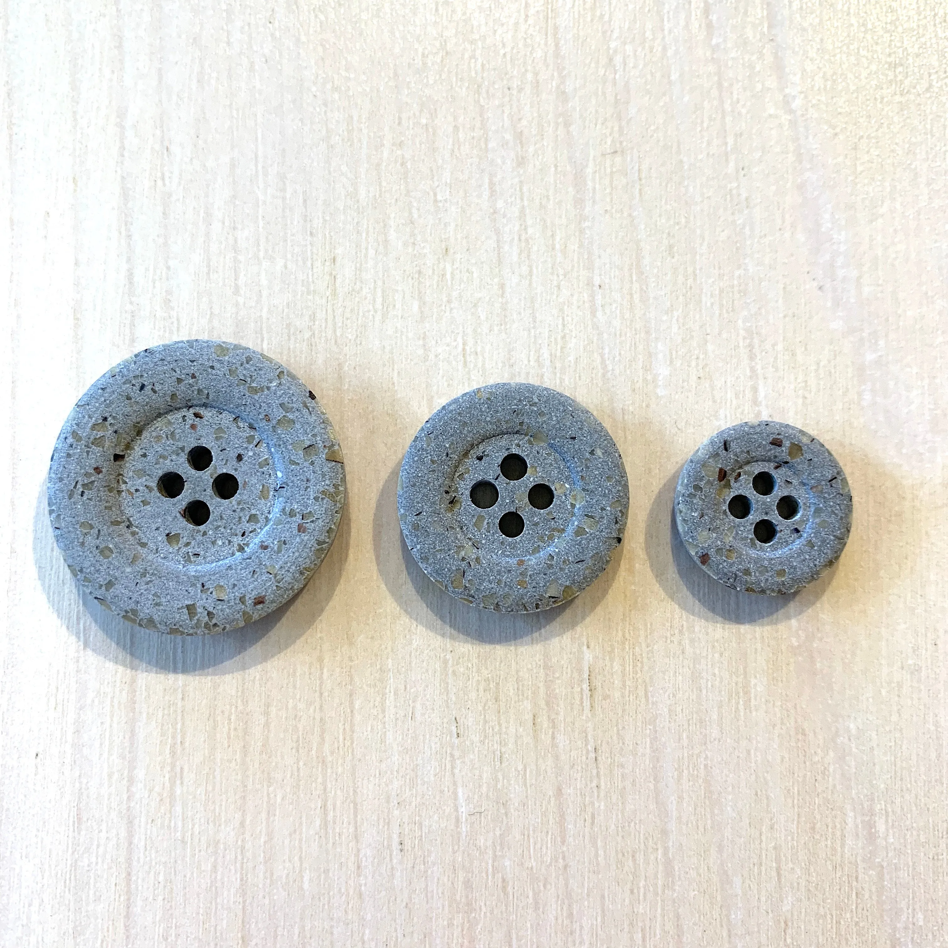 Recycled polyester buttons